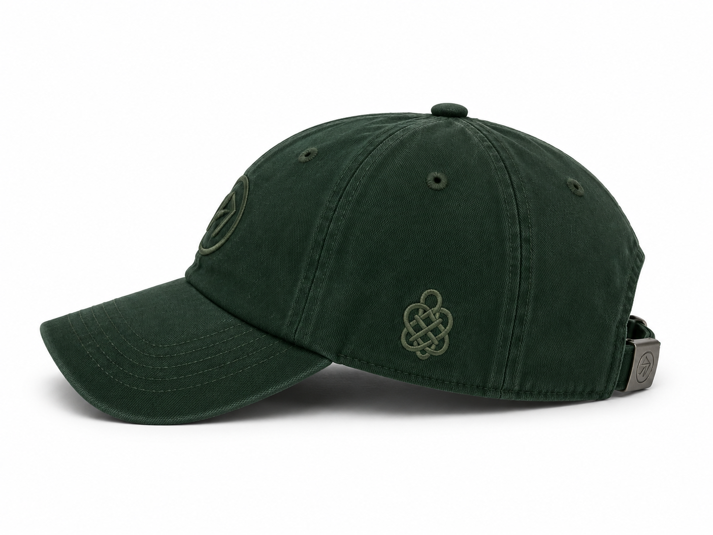 Emerald cap — side view with tonal Celtic knot embroidery.