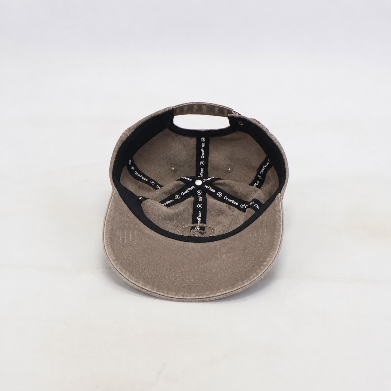 Inside of the Heritage Washed Cap showing the branded OneFaze taping